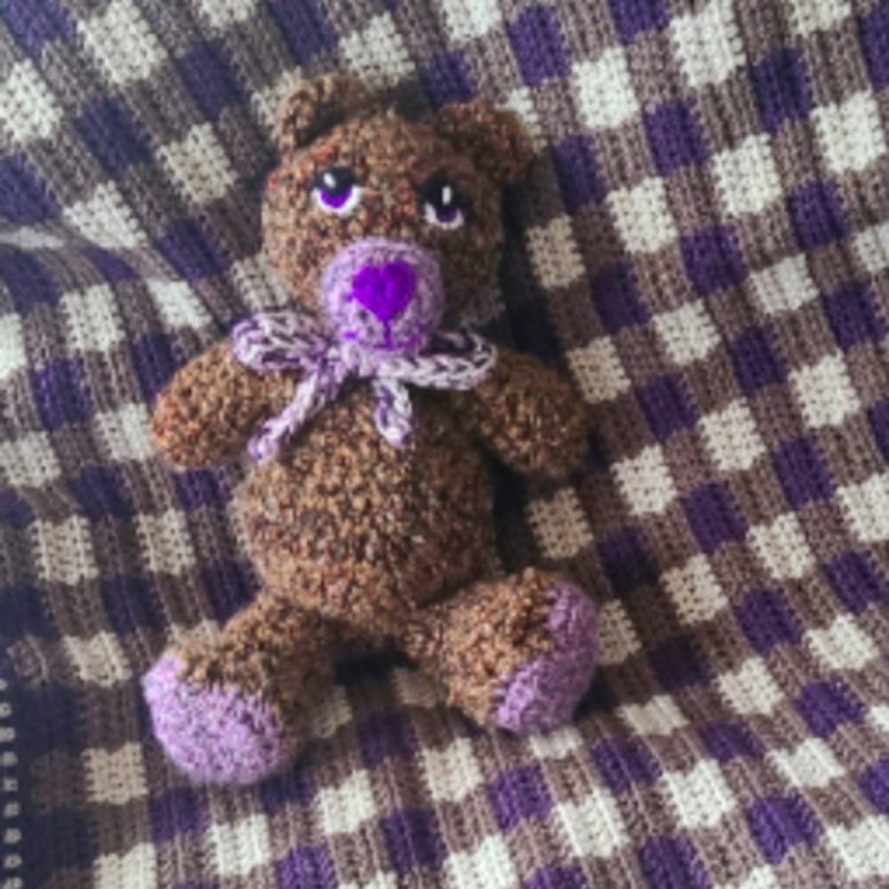 Handmade gingham-patterned blanket with matching teddy bear